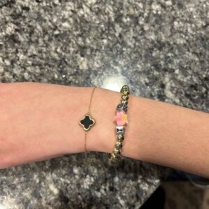 Elegant Gold and Black Clover Bracelet